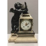 IN THE MANNER OF AUGUSTE MOREAU, A 19TH CENTURY BRONZE AND WHITE MARBLE CHIMING MANTLE CLOCK Figured