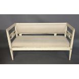 AN EARLY 19TH CENTURY SWEDISH TWO SEAT SETTEE The painted and pierced lyre frame with single drop