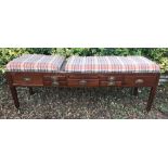 AN EDWARDIAN MAHOGANY CHEQUER UPHOLSTERED HOSPITAL BED With an arrangement of seven drawers and a