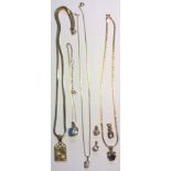 A COLLECTION OF VINTAGE 9CT GOLD AND GEM SET PENDANTS Two set with cabochon cut opals, garnet and
