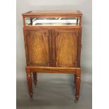 A WILLIAM IV PERIOD MAHOGANY BIJOUTERIE COLLECTOR'S CABINET The glazed top above two doors enclosing