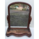 A VICTORIAN DRESSING TABLE MIRROR On a serpentine base with bun feet. (h 76cm x w 66cm)