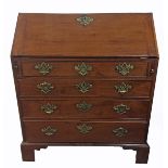 AN 18TH CENTURY SOLID MAHOGANY BUREAU The fitted interior over four long graduated drawers,