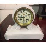 A VICTORIAN PARIAN CASED STRIKING CLOCK Having a round dial, Arabic numerals and painted with