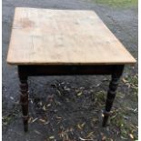 A VICTORIAN PINE FARM HOUSE TABLE With two drawers, raised on turned legs. (150cm x 105cm x 74cm)