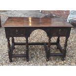 A JACOBEAN STYLE TWO DRAWER TABLE. (118cm x 58cm x 73cm)