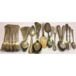 A SET OF EIGHT EARLY 20TH CENTURY DANISH SILVER DESSERT SPOONS The finials decorated with a stylized