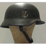 A WORLD WAR II GERMAN 55 M40 SINGLE DECAL HELMET Liner and chinstrap present. Condition: light