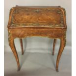 A 19TH CENTURY FRENCH KINGWOOD AND FLORAL MARQUETRY INLAID BUREAU DE DAME Applied with decorative