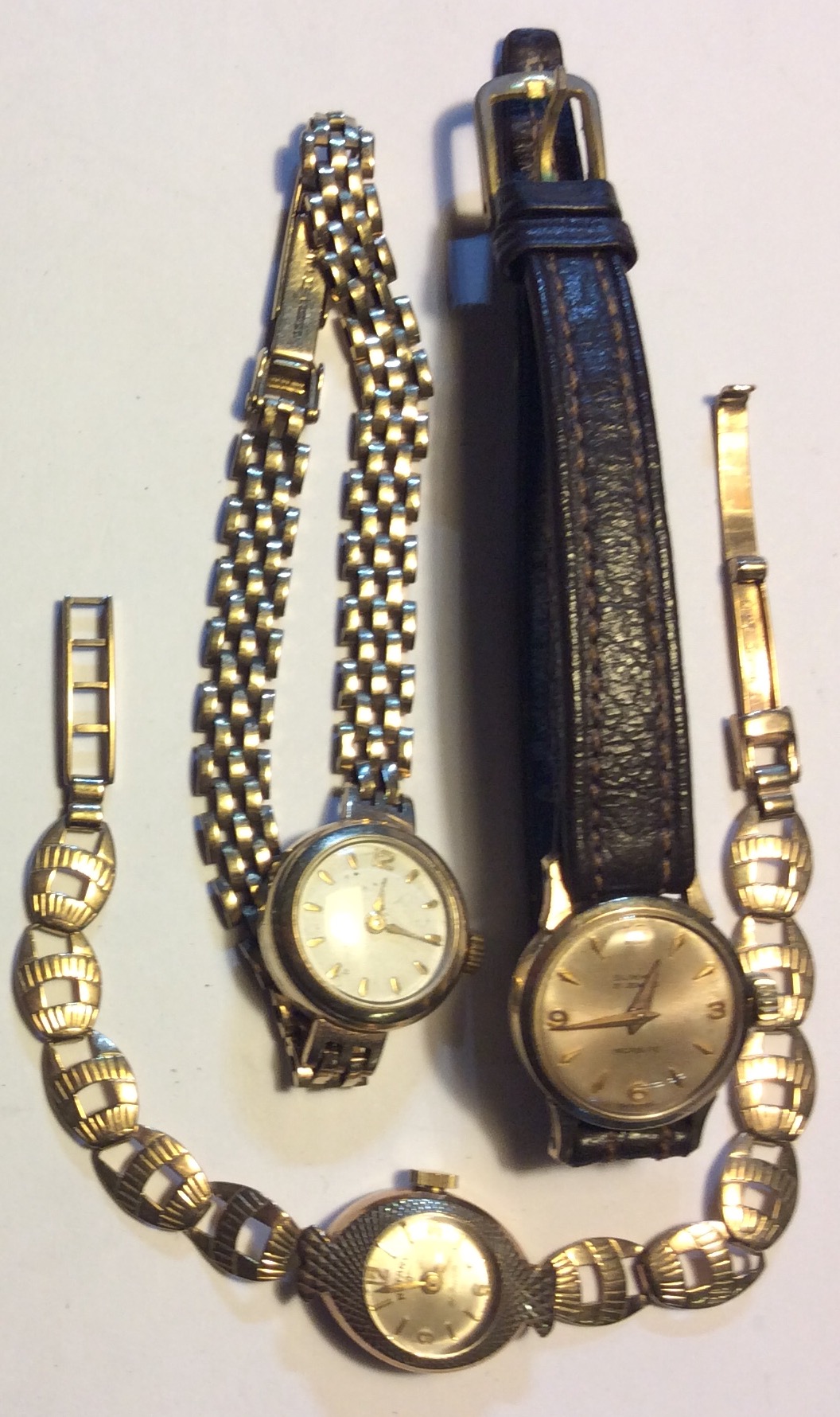 A COLLECTION OF THREE VINTAGE 9CT GOLD LADIES' WATCHES To include Rotary, with a fancy link bracelet