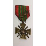 A FRENCH WORLD WAR II CROIX DE GUERRE WITH RIBBON AND OAK LEAF.