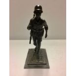 A LATE 20TH CENTURY BRONZE OF A GERMAN SOLDIER With full kit in marching position, signed 'R.