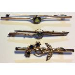 A COLLECTION OF THREE VICTORIAN 9CT GOLD GEM SET BAR BROOCHES To include a single round cut peridot,