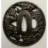 A 20TH CENTURY TSUBA Decorated with a horse and waves, with feint signature.