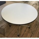 HERMAN MILLER, A CIRCULAR DINING TABLE On a steel and aluminium base. (94cm x 66cm)