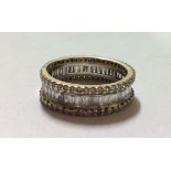 A VINTAGE 18CT GOLD AND DIAMOND FULL ETERNITY RING Having a single row of baguette cut diamonds