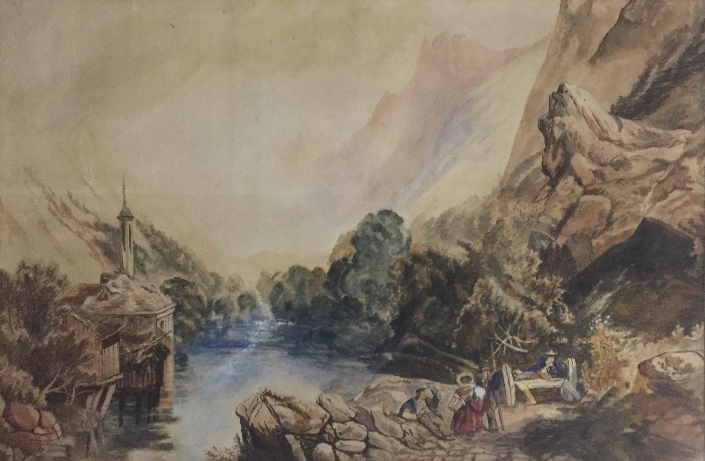 A 19TH CENTURY ENGLISH ROMANTIC SCHOOL WATERCOLOUR Peasants by a riverside shrine, framed. (33cm x