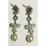 A PAIR OF PLATINUM, PEARL AND DIAMOND ENCRUSTED EARRINGS. (drop 4cm)