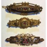 A COLLECTION OF THREE VICTORIAN 9CT GOLD AND GEMSET BROOCHES Two set with garnets and seed pearls,