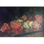 AN EARLY 20TH CENTURY ENGLISH SCHOOL OIL ON PANEL Roses on a polished table, framed. (24cm x 34cm)