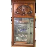 A REGENCY DESIGN PINE FRAMED MIRROR With shell cartouche above a silvered plate. (75cm x 150cm)