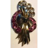 A VINTAGE YELLOW METAL, TOURMALINE AND DIAMOND BROOCH The arrangement of graduated stones forming