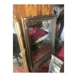 A REGENCY DESIGN HEAVY GILT FRAMED MIRROR With bevelled plate. (130cm x 145cm)