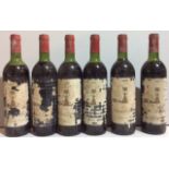 CHÂTEAU CLERC MILON, 1975, SIX BOTTLES OF VINTAGE RED WINE Each having a red seal cap, bearing label