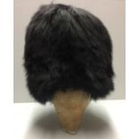 WITHDRAWN GUARDS BUSBY, A CANADIAN BROWN/BLACK BEAR FUR. Condition: good, without chin scales