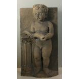 ARCHITECTURAL INTEREST, A CAST STONE FRIEZE OF A CLASSICAL STYLE PUTTI CASTED IN RELIEF Reading a
