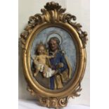 A VICTORIAN PLASTER CAST ECCLESIASTICAL PORTRAIT OVAL PLAQUE Set with glass eyes, held in a carved