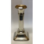 NAPPER & DAVENPORT, AN ART DECO SILVER CANDLESTICK With octagonal form column, raised on a downswept