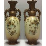 VIENNA, A PAIR OF 19TH CENTURY PORCELAIN VASES Hand painted with flowers in a blush ivory style