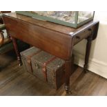A 19TH CENTURY MAHOGANY PEMBROKE TABLE Having two fold down leaves, pull out drawer and tapering