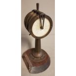 A 20TH CENTURY MARINE BRASS SHIPS TELEGRAPH DESK ORNAMENT The circular dial hand written with