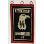 A DAS REICH HEAVY CARPET STYLE MATERIAL TABLE FLAG With three brass hanging loops.