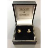 BROOKS & BENTLEY, A PAIR OF 9CT GOLD AND DIAMOND EARRINGS In the form of pierced hearts. (w 0.8cm