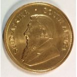 A 22CT GOLD KRUGERRAND ONE OZ COIN, 1974 Bearing portrait of the South African President