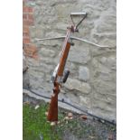 A 20TH CENTURY OAK AND STEEL MARITIME CROSSBOW The carved wooden handle set with steel mounts and