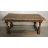 A 17TH CENTURY SOLID WALNUT CENTRE TABLE The single plank top above an arcaded frieze, raised on