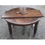 A VICTORIAN MAHOGANY WIND OUT TABLE Complete with an extra leaf and winder. (105cm closed x h 72cm x