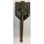 A KOREAN/VIETNAM ENTRENCHING TOOL WITH COVER.