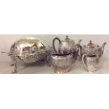 AN EARLY 20TH CENTURY SILVER PLATED REVOLVING BREAKFAST DISH Having a dome shaped top and raised
