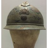 A WORLD WAR I FRENCH ADRIAN INFANTRY HELMET. Condition: chinstrap broken, liner good, surface rust