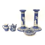 A Wedgwood blue and white jasperware, pair of candlesticks, 20cm, pot pourri, small jug and coffee