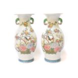 A pair of Republican period Chinese vases, each decorated in the famille rose pattern, with birds