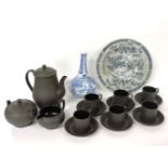 A Wedgwood black basalt coffee set, a Chinese blue and white plate and a vase