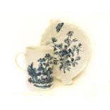 An 18th century Worcester blue and white leaf dish, printed with flower spray and a butterfly,