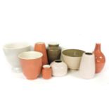 Poole Pottery, a collection of vases and bowls in peach, cream and brown, largest 22.5cm high (9)