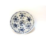 A Chinese blue and white bowl, with a four character mark, cracked and chipped, 26cm diameter